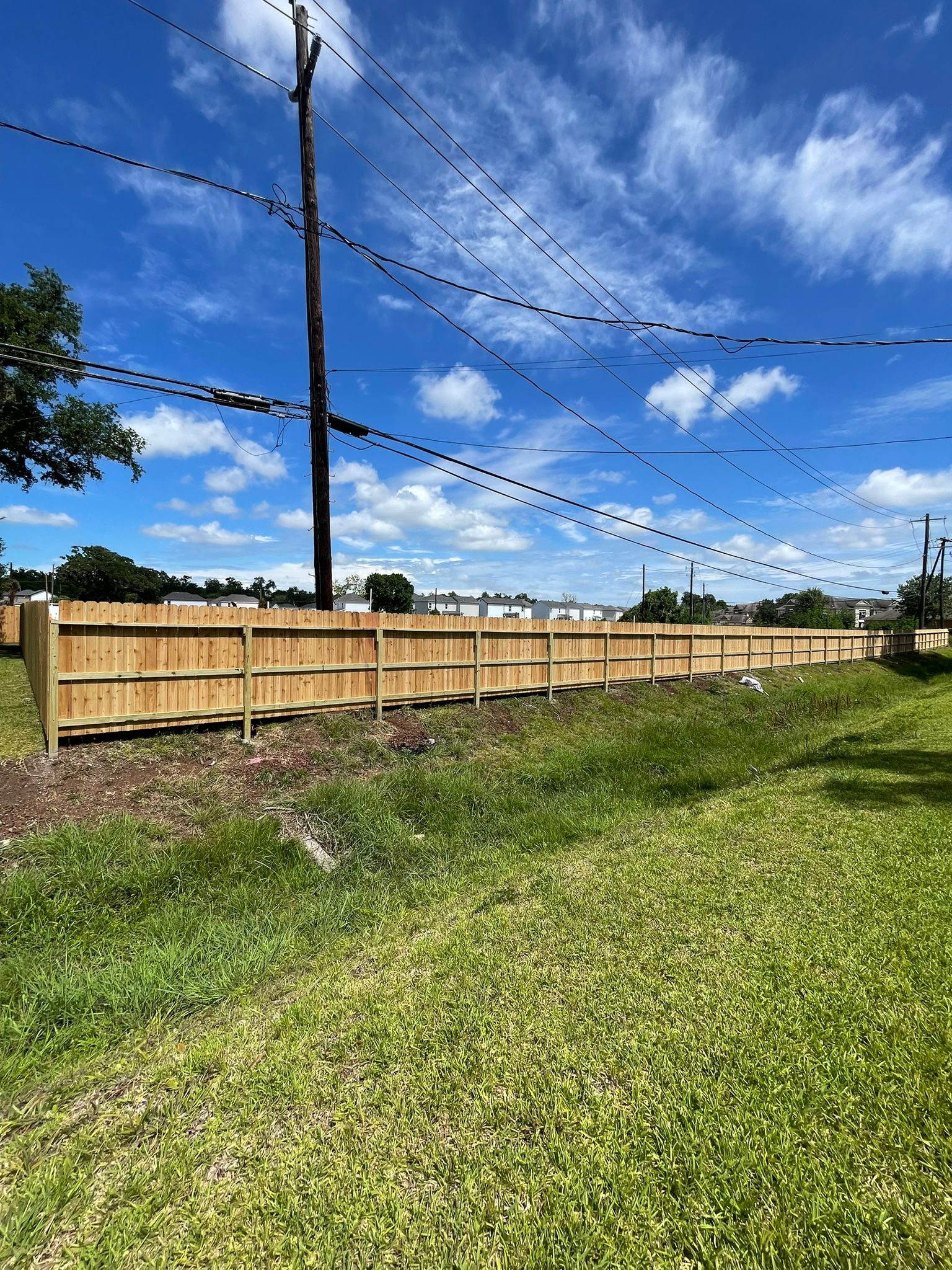 Completed residential wood fence installation in Houston, Texas